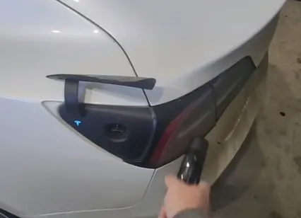 tap the tail light to charge a tesla